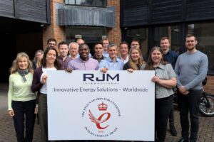 The RJM Team with Kings Award Banner